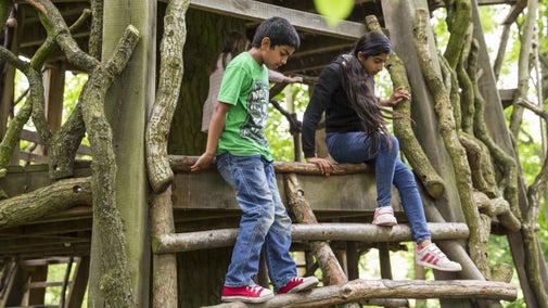 Children enjoying the adventure play area at Moseley Old Hall, Staffordshire